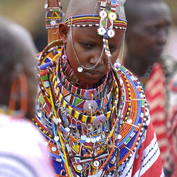 Maasai bride Namunyak Baiera wears traditional bead necklaces during her wedding in Olepolos village, 120 km (74 miles) southeast Nairobi, March 31, 2007. In the Maasai tradition the groom has to pay for his bride in cows and sheep, which have to be brought to her family on the wedding day. REUTERS/Damien Guerchois (KENYA) - RTR1ODTF